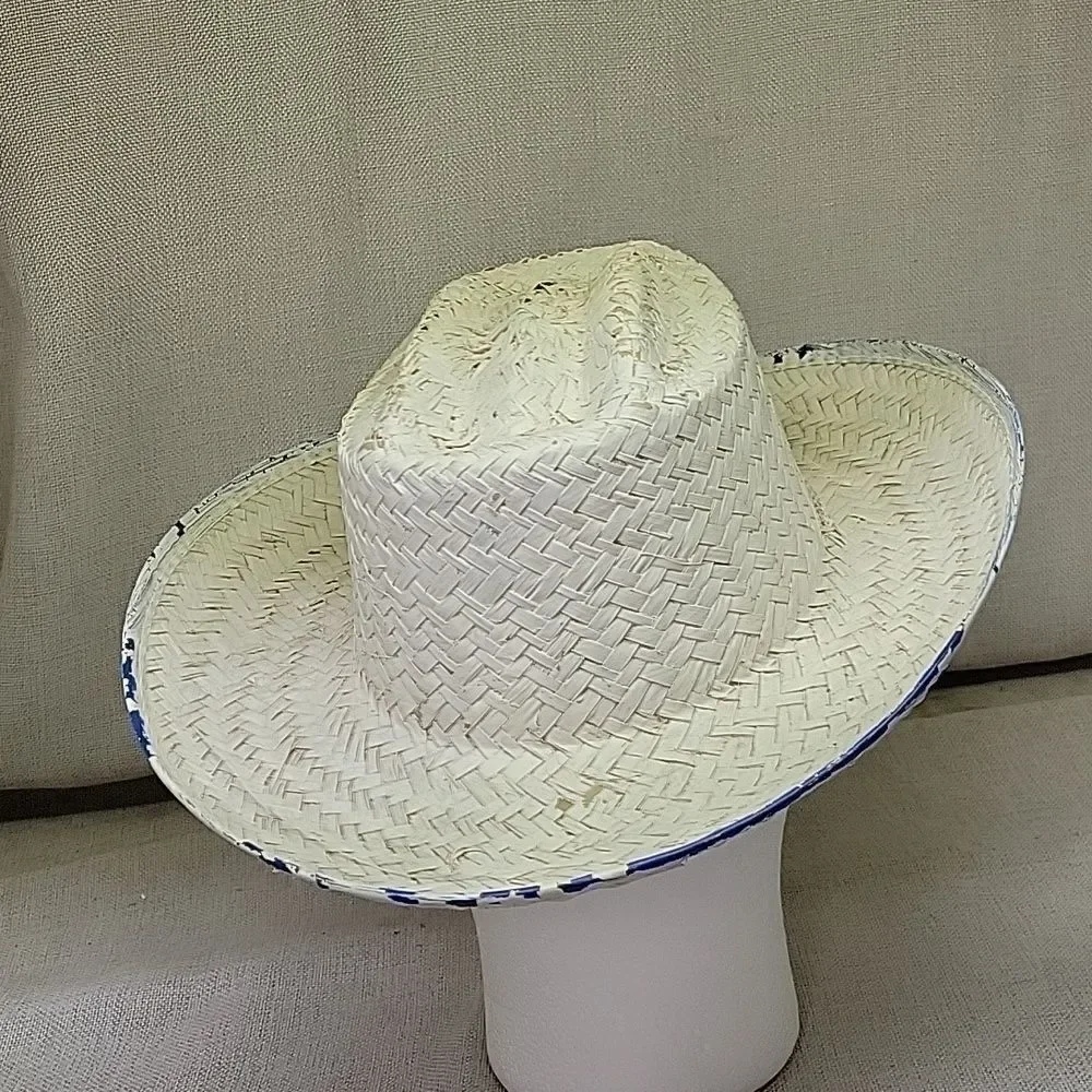 Straw‎ cowboy hat with blue trim.